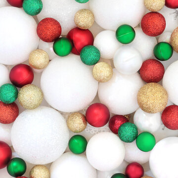 Christmas decorations for background. Festive sparkling gold, red, green, white, tree baubles symbols of Xmas for greeting card. 
