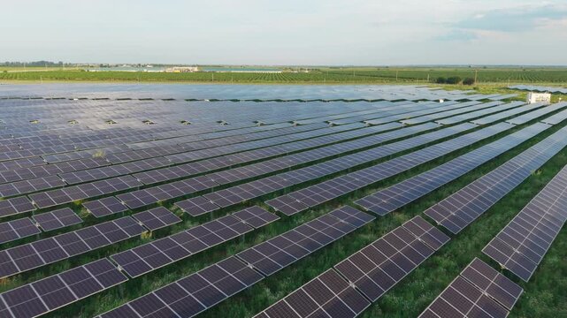Vast Photovoltaic Rows Reaching Rural Horizon
