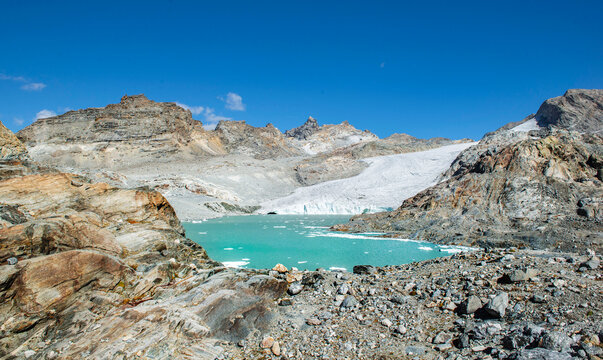glacier the grand Meant and  lake  in french alpine mountains under a blue sky in the Vanoise park, Savoie