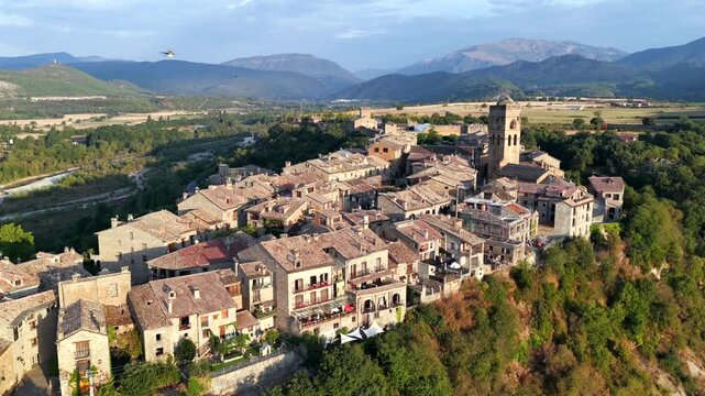 Aerial view above medieval village of Ainsa and castle in Spanish Pyrenees, Huesca, Spain
