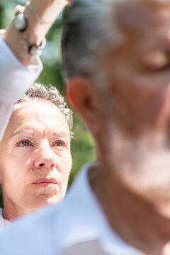 Concentrating on subtle energy work during a guided spiritual healing session, promoting mindful awareness, emotional balance, inner calm, and holistic wellbeing.
