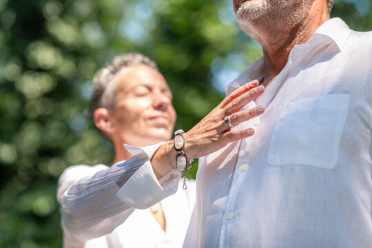 Practitioner using gentle hand placement around the upper chest during a heart-centered chakra balancing practice, encouraging spiritual connection, emotional balance, and holistic wellbeing.