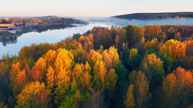 Beautiful aerial autumn landscape with forest park, lake and a city H&auml;meenlinna in Finland