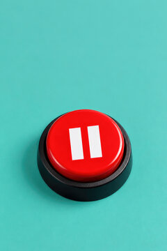red button with pause symbol