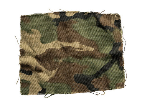 Close-up of camouflage fabric with frayed edges and stitching.
