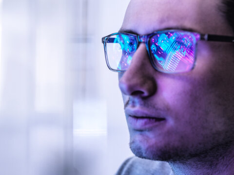 Electronics engineer looks at a computer screen with AI technology