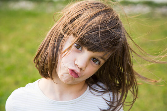 Portrait of little girl pouting