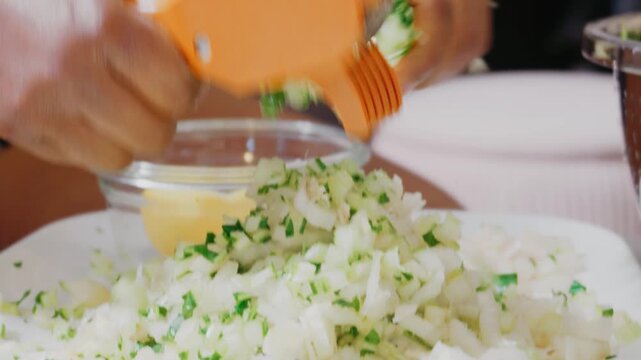 Black woman using vegetable chopper