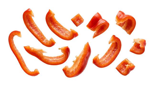Red bell pepper slices and diced pieces flying in the air, fresh sweet paprika vegetable, PNG, isolated on transparent background