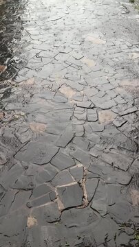 Water Ripples Across Uneven Stone Path