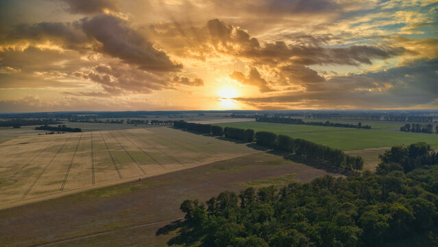 Aerial View of a Field Landscape During a Spectacular Sunset.