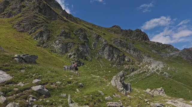 Rugged Parang Crags Rising From Green Meadow