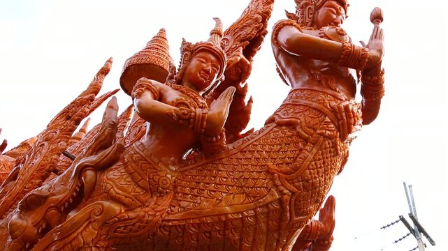 Beautifully carved wax float procession in Ubon Ratchathani Candle Festival, Thailand.