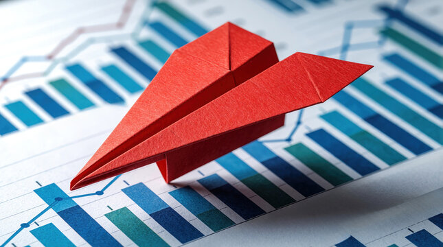 Red origami paper plane flies over blue business financial charts. Concept of leadership, unique direction in market competition. Red plane shows way for team to achieve growth, success. Creative