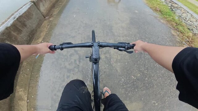 First Person View Cycling on Wet Road