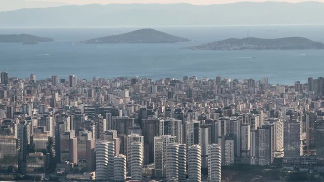 View of the city skyline and islands from a high vantage point near the coast
