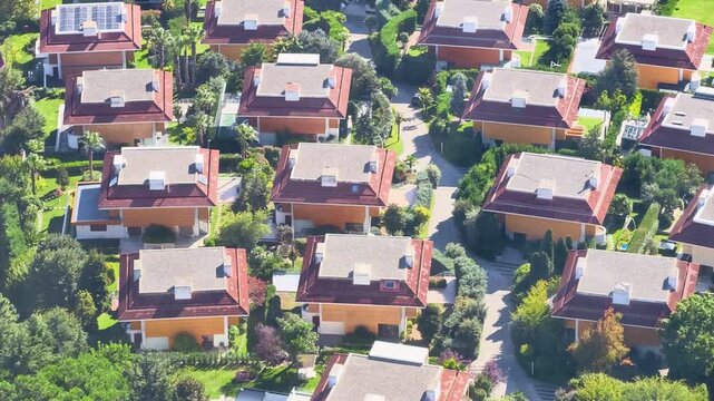 Overview of a residential area with houses from above in bright sunlight
