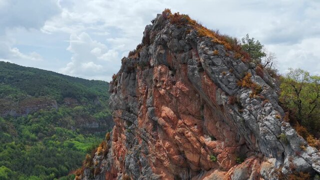 Aerial view of premature foliage yellowing and colorful dry mountain slopes due to severe heatwave near Ainsa, Pyrenees, Spain