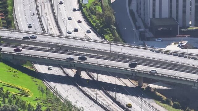 Traffic flow on busy highway in urban area during midday hours