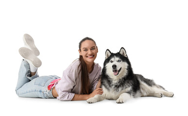 Pet ownership and companionship happy young woman lying on floor with her husky dog animal welfare and friendship lifestyle portrait on white background © Pixel-Shot
