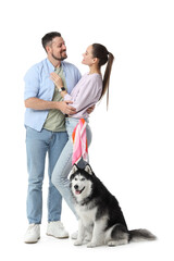 Pet ownership and companionship, happy couple embracing with their husky dog on a white background © Pixel-Shot