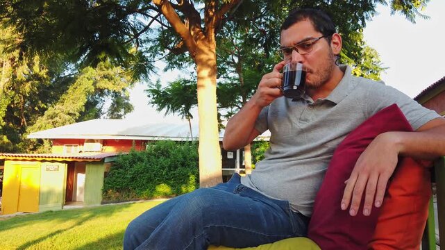 Young Jewish man drinking coffee in an Israeli kibbutz