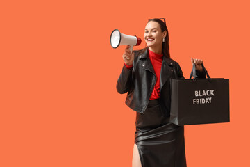 Obraz na płótnie Canvas Black Friday sale announcement, happy woman holding shopping bag and megaphone for retail marketing campaign on orange background