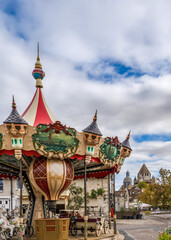 France: Decorative Jules Verne themed carousel on Place du Châtel in the medieval city of Provins, with thalf-timberd-houses in the background. © Angela Meier