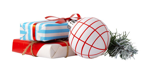 Fototapeta premium Colorful Christmas gifts and ornaments on a plain background ready for holiday celebrations