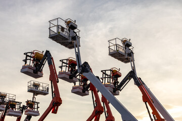Articulate boom lift with blue sky background, Aerial platform lift telescopic boom lift hydraulic boom lift, Mobile construction crane, Construction boom lifts © Kalyakan
