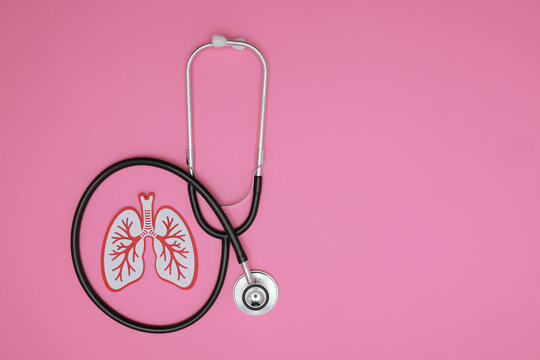 Preventive lung care concept with stethoscope offering calm hope and reassurance for healthy respiratory wellness on pink background