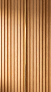 Wood slat wall panel texture with vertical oak lamellas and brass inlay in warm light, close up