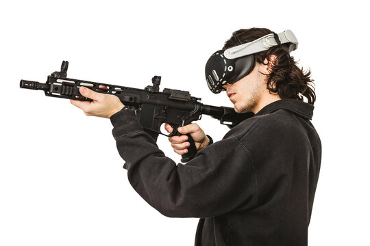 Man wearing virtual reality headset aiming AR-15 rifle controller in VR training simulation