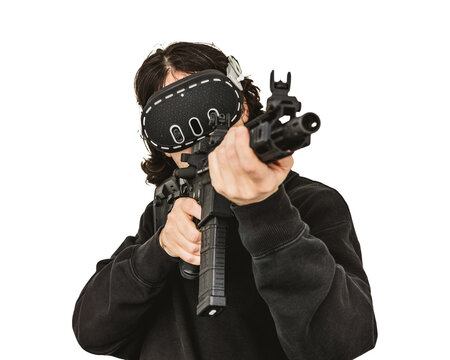 Man wearing virtual reality headset aiming AR-15 rifle controller in VR training simulation