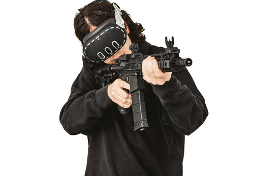 Man wearing virtual reality headset aiming AR-15 rifle controller in VR training simulation