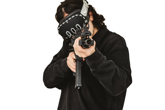 Man wearing virtual reality headset aiming AR-15 rifle controller in VR training simulation