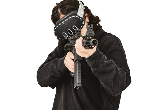 Man wearing virtual reality headset aiming AR-15 rifle controller in VR training simulation