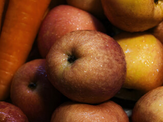 Close up food, fresh apple with water drops on the skin very freshness looking and to eat. vegan, color, diet, advert, publish, advt, art, arts, moisture, orange, yellow, focus, lighting, fine art © Pongsatorn