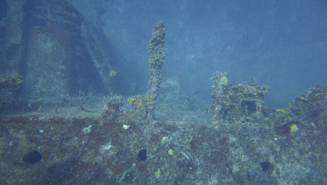 Travel and History: Coral Encrusted Mast and Deck Superstructure on Submerged USCG Bibb Shipwreck Wreckage in Key Largo, Florida
