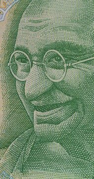 Sequence of Detailed Banknotes from Many Countries. Banknotes from various countries change rapidly revealing detailed portraits wildlife buildings and ornate currency designs.