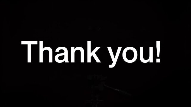 Animated typing text Thank you with a solid block cursor on a black background