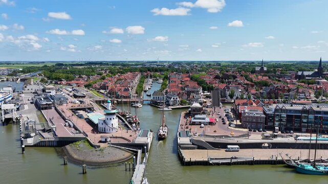 Aerial view of Harlingen with boats sailing through the canals in the Netherlands