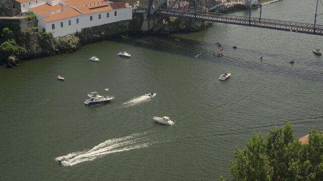 Boats Leaving Wakes on a River