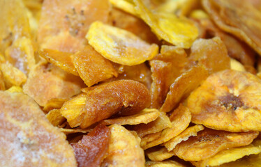 Background filled with fried plantain chips © Myrarte
