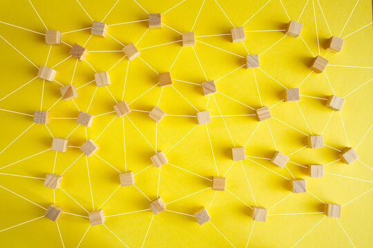 Business concept for network structure with connected people, showing teamwork,collaboration, stakeholder mapping, social graph, and business communication on yellow background
