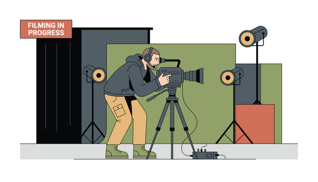 Professional cameraman recording video with a large camera on a tripod inside a studio under spotlight illumination.