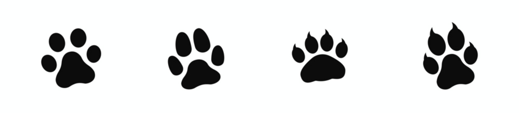 Set of four black animal paw prints on white background