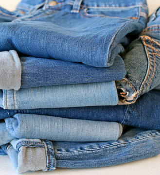 Neat stack of folded blue denim jeans