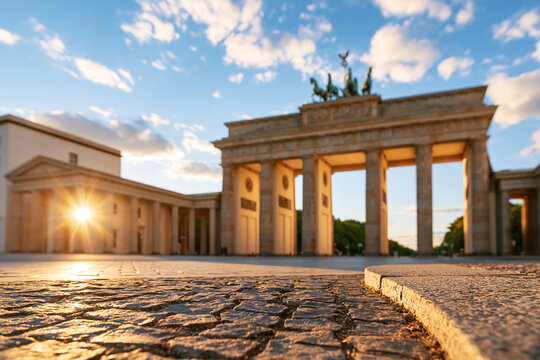 Sunset glow illuminating historic stone gate monument