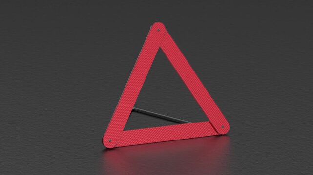 Emergency warning triangle on asphalt road
